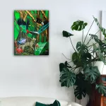 Forest painting hanging on a wall.